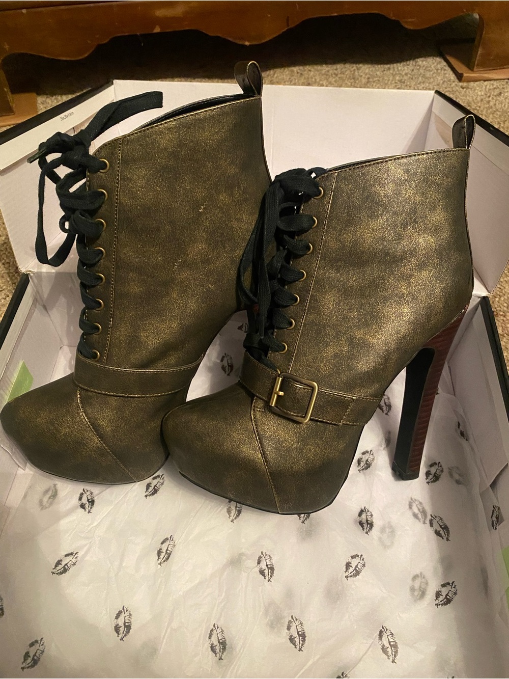 Colin Stuart lace-up booties featuring a striking metallic gold finish